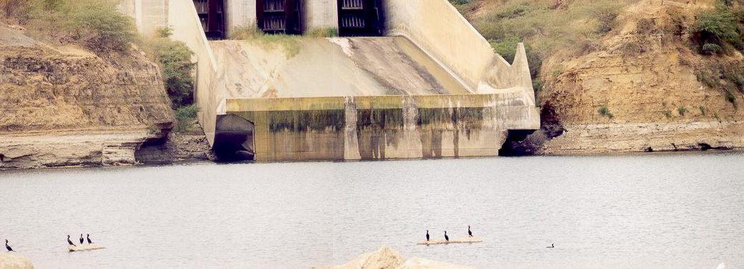 Close-up of ski-jump spillway at Poechos Dam, showing erosion damage