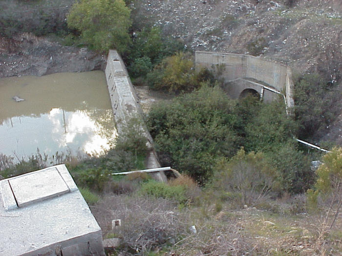 Discharge of treated sewage at the sediment detention basin.