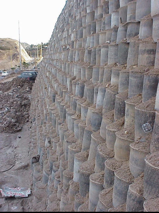 Side view of retaining wall built with discarded tires