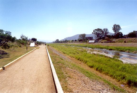 Detail of bank protection with gabions on the left margin.